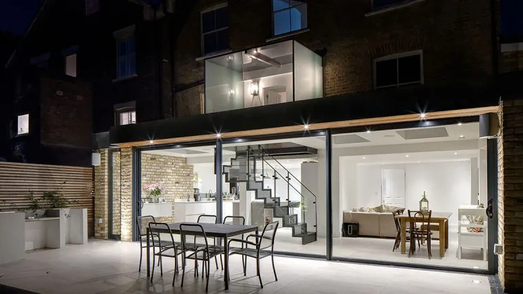 Rose Brentwood Four Storey Refurbishment Contemporary Basement Extension glass box extension roof Alfreso Dining Night Time View