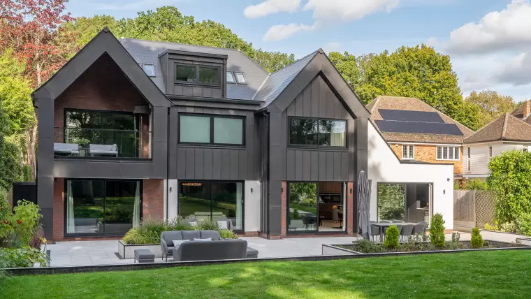 Badgers Billericay Extensions Stairway contemporary open plan kitchen roof lighting outdoor living garden rear elevation balcony zinc cladding