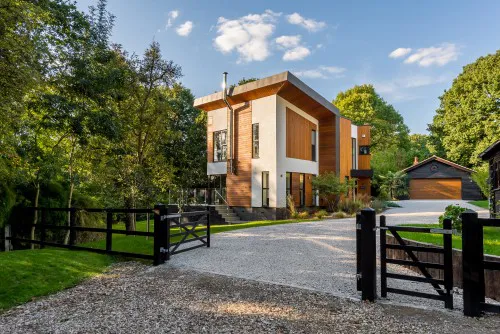 Yggdrasil Billericay butterfly wing formed zinc wrap Two storey green belt garage New Build Contemporary Home