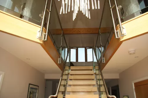 Crumbles West Mersea Colchester New Build Eco Home main hall vaulted ceilings central timber glass stainless steel staircase