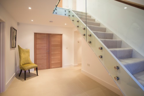 Roundwood House Shenfield Essex Private Residence a three storey stairwell frameless glass balustrades