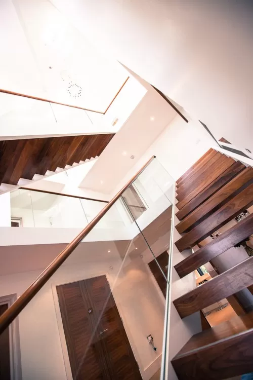 Piran Hutton Shenfield Essex Major Contemporary Extension Refurbishment glazed roof windows three storey vaulted central stairway natural light