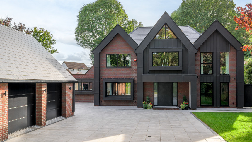 1.Hero Badgers Billericay Extensions Stairway contemporary open plan kitchen roof lighting outdoor living garden rear elevation balcony zinc cladding double garage front glazed windows zinc gables inset brickwork