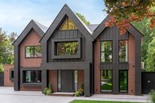 Badgers Billericay Extensions Stairway contemporary open plan kitchen roof lighting outdoor living garden rear elevation balcony zinc cladding double garage front glazed windows inset brickwork zinc gables