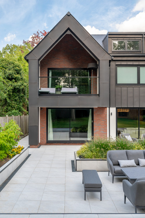 Badgers Billericay Extensions Stairway contemporary open plan kitchen roof lighting outdoor living garden rear elevation balcony zinc cladding glazed windows