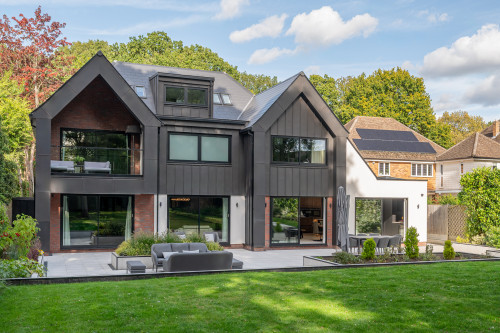 Badgers Billericay Extensions Stairway contemporary open plan kitchen roof lighting outdoor living garden rear elevation balcony zinc cladding