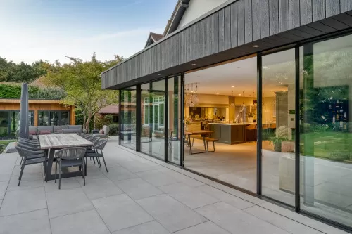 Kynnersely Contemporary Single Storey Extension zinc modern slidingdoors open plan shenfield garden alfresco dining